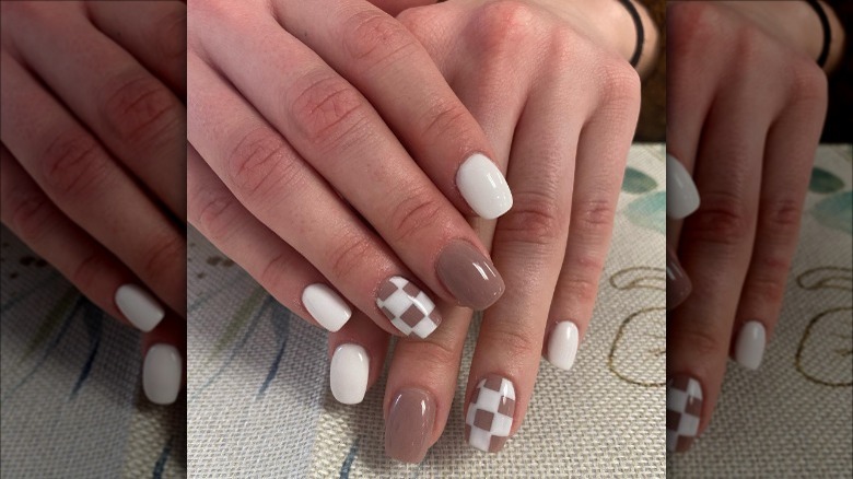 woman with beige checkered nails