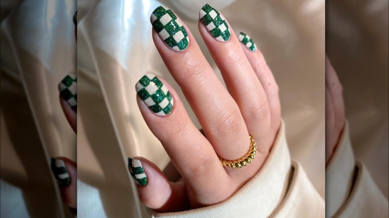 woman with glitter checkered nails