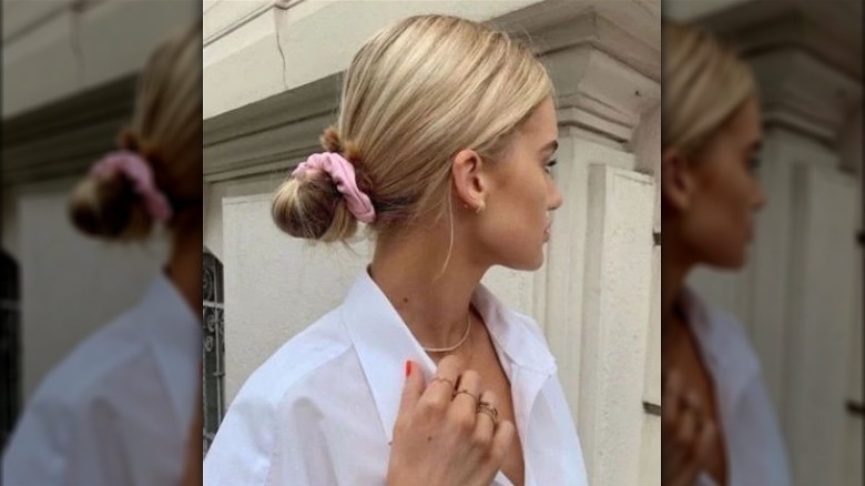 Low bun hairstyle with a scrunchie