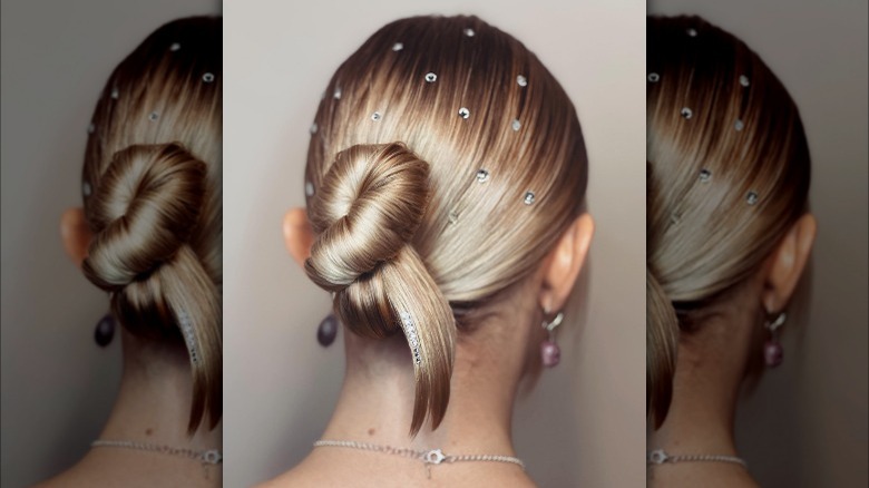 Asymmetrical chignon style with hair gems 