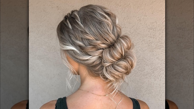 Chignon hairstyle with wispy twisted pieces 