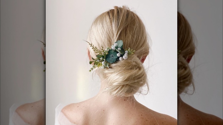 Chignon hairstyle with floral hair clip