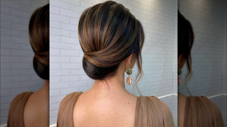 Sleek side-swept chignon hairstyle