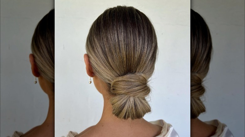 Chignon hairstyle with hair wrap detail 
