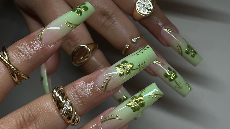 Green nails with chrome flowers
