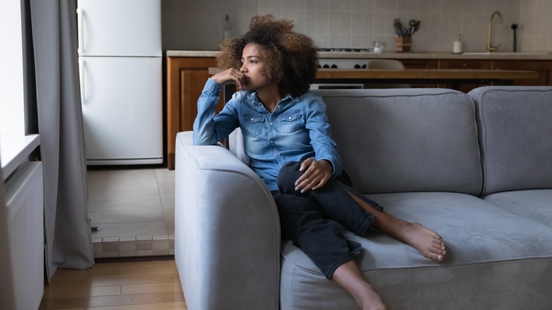 woman upset on the couch