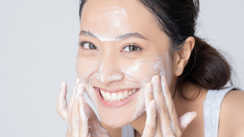 Woman washing face 