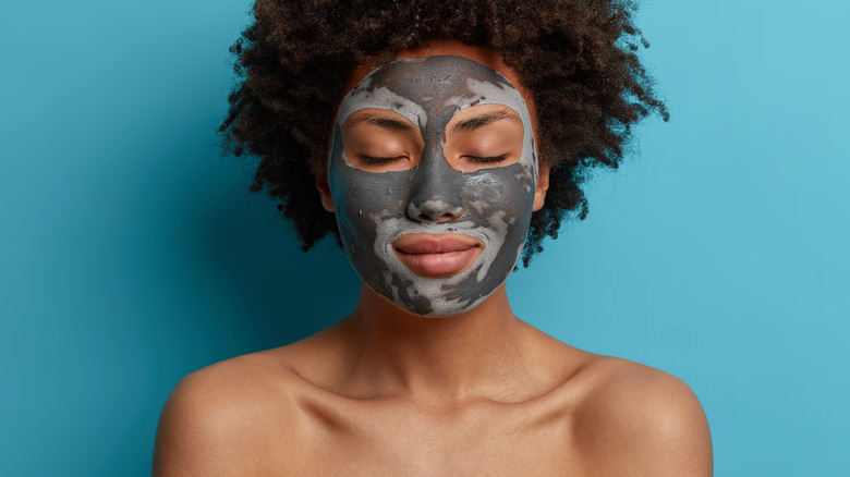 Woman with clay face mask