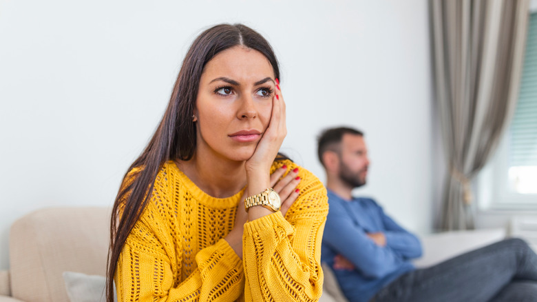 woman thinking on couch