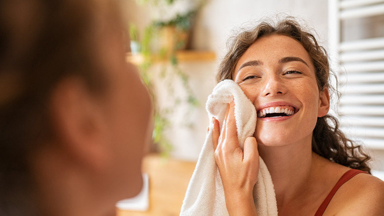 Woman washing her face