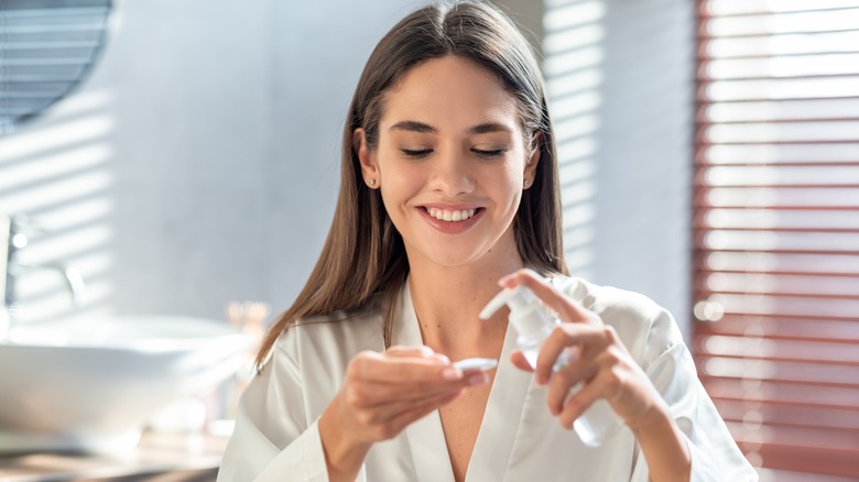 Woman using a makeup remover