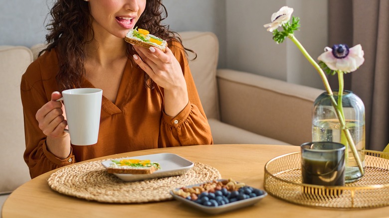 Woman having coffee at breakfast