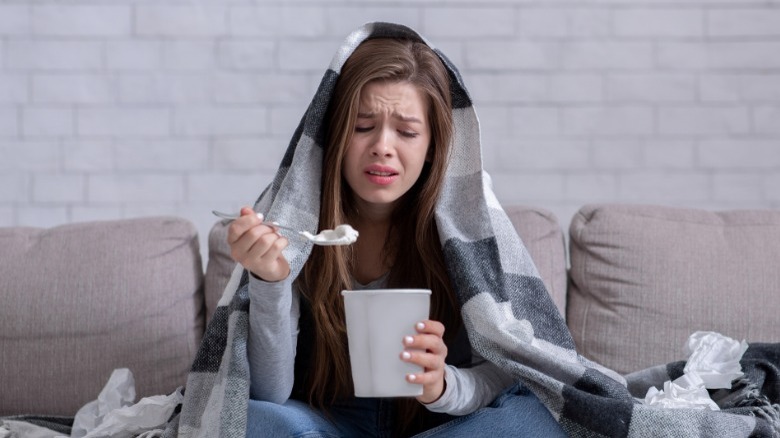 Woman crying eating ice cream