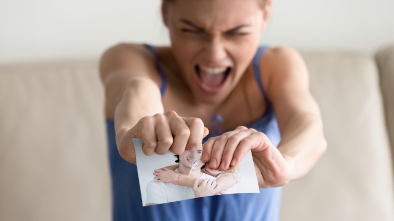 Woman ripping up boyfriend photo