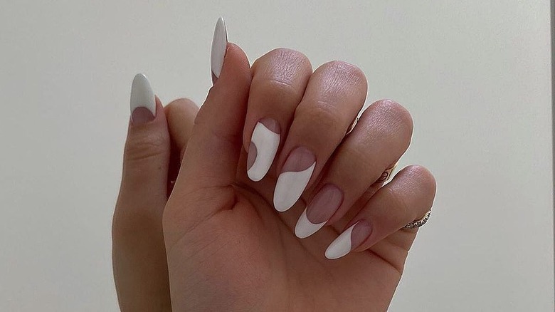white nail polish in abstract shapes