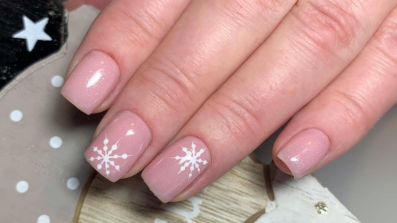 pink sparkle manicure with snowflakes