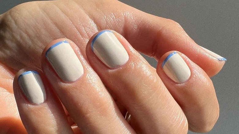 reverse french manicure with blue tip