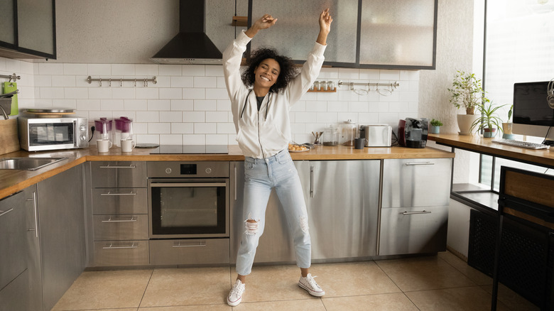 Woman dancing in her kitchen