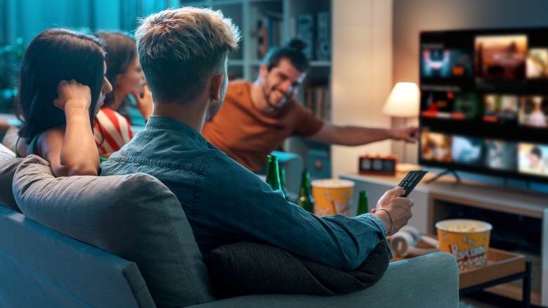 A group of friends watching TV