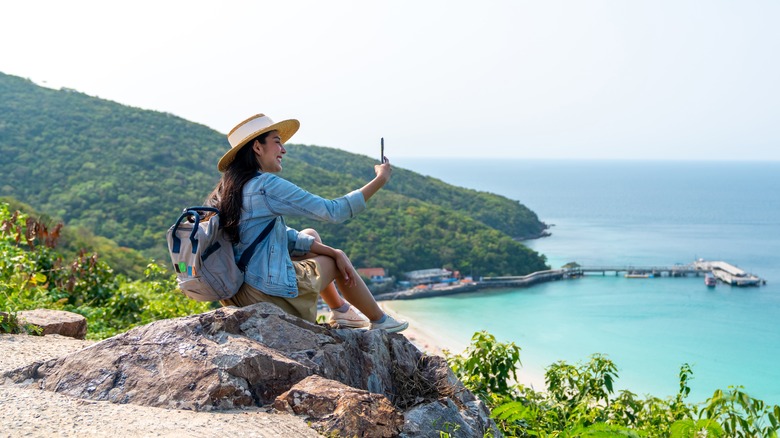 Woman taking a selfie on her travels