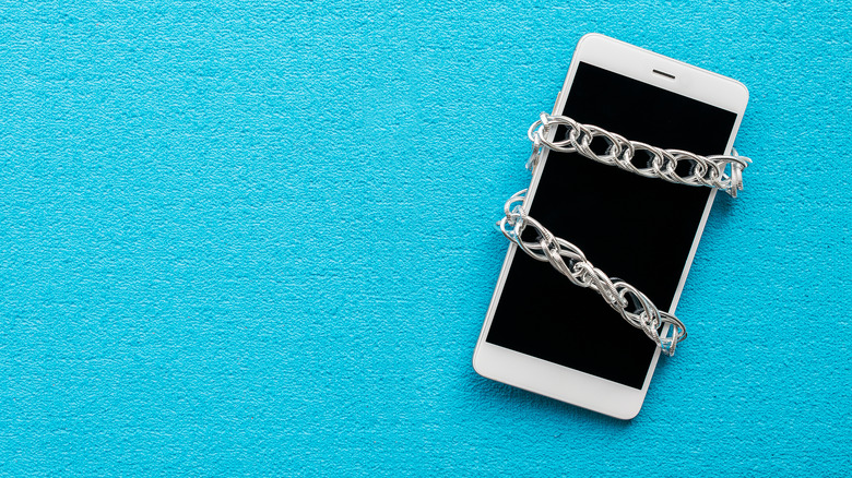 A cellphone wrapped in chains