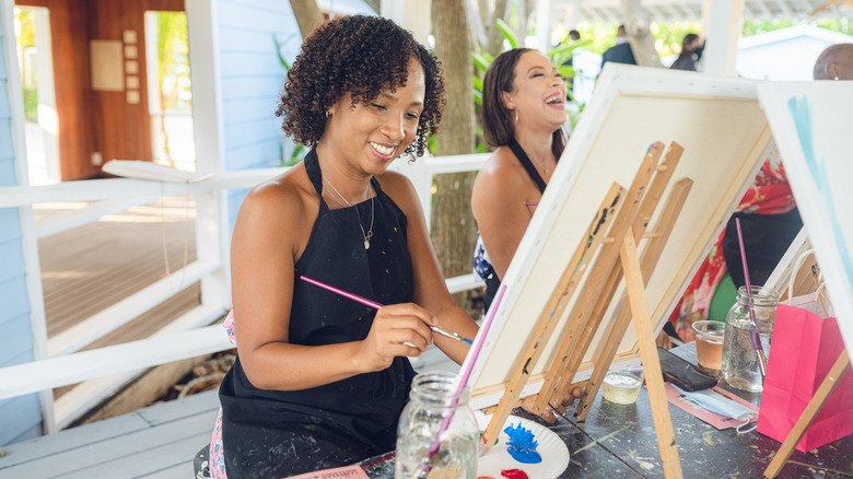 Women taking a painting class