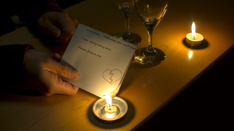 Person burning a love letter