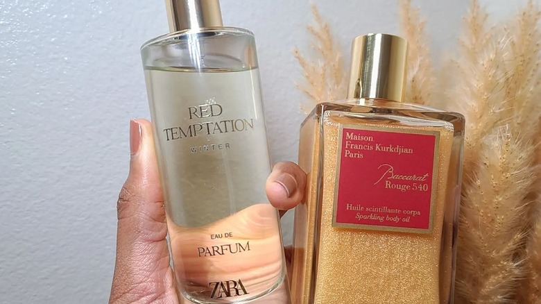 Zara and Baccarat perfumes in hand