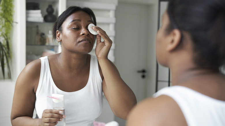 Woman using micellar water