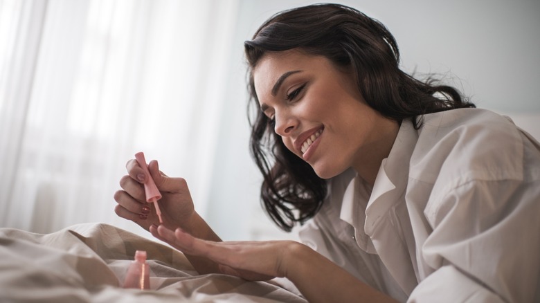 a woman doing her nails