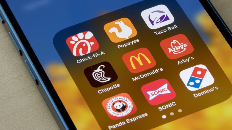 Phone screen displaying several fast food loyalty apps