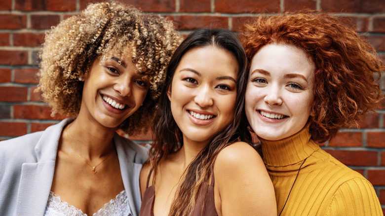 Three women with curls