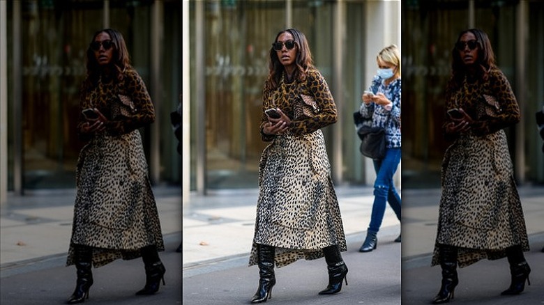 woman wearing cheetah top and skirt