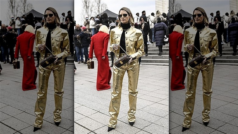 woman wearing metallic jacket and pants