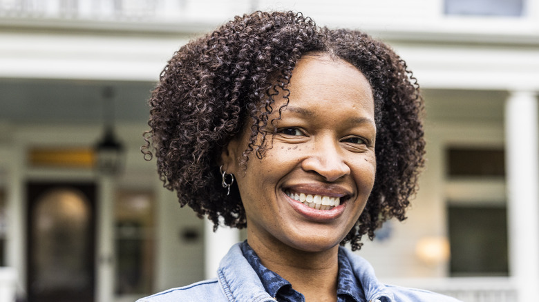 Person with layered coily bob haircut