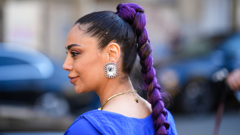 Woman wearing statement crystal earring