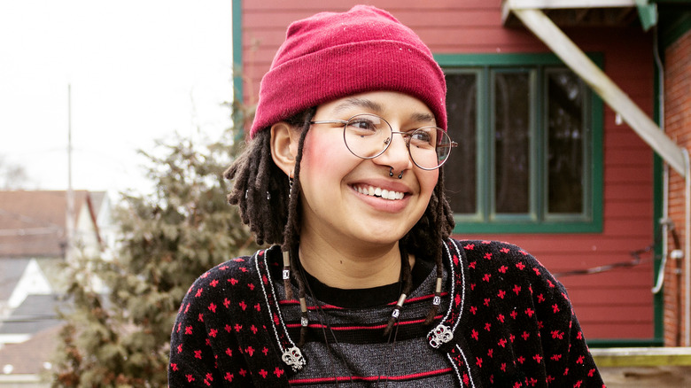 Woman pink beanie glasses