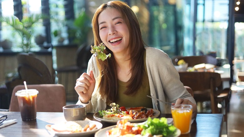 Woman eating at a restaurant