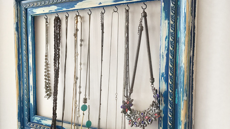 Necklaces hanging from hooks