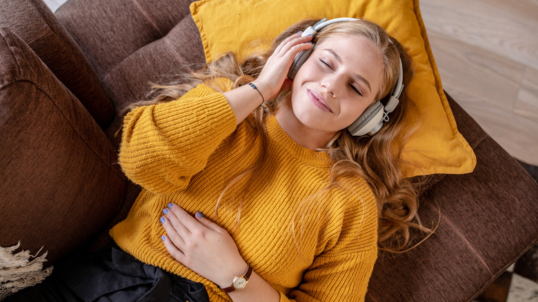 smiling woman wearing headphones