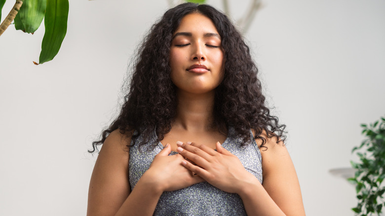 woman relaxing with eyes closed