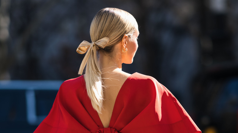 Woman wearing bow in ponytail