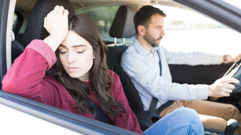 Couple fighting in car