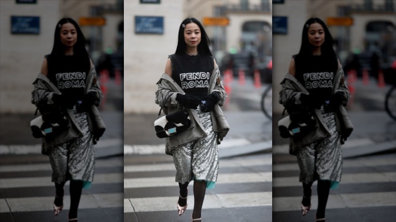 woman wearing Fendi outfit with baguette bag