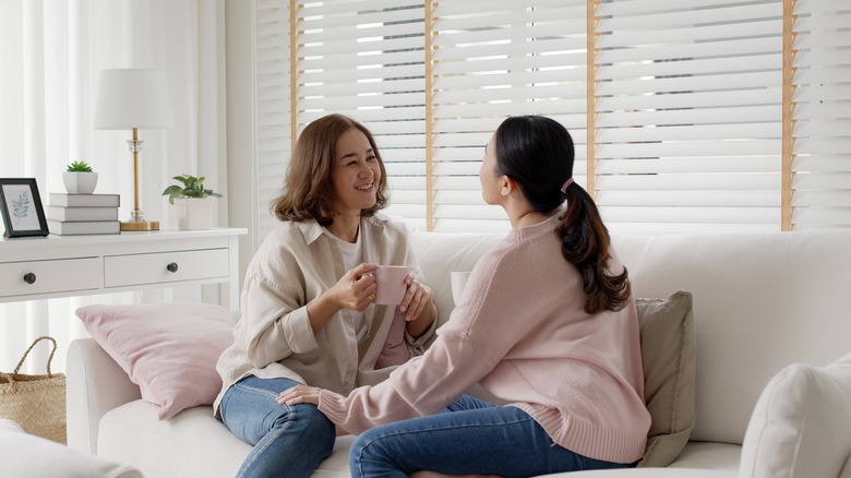 Two friends sitting on couch