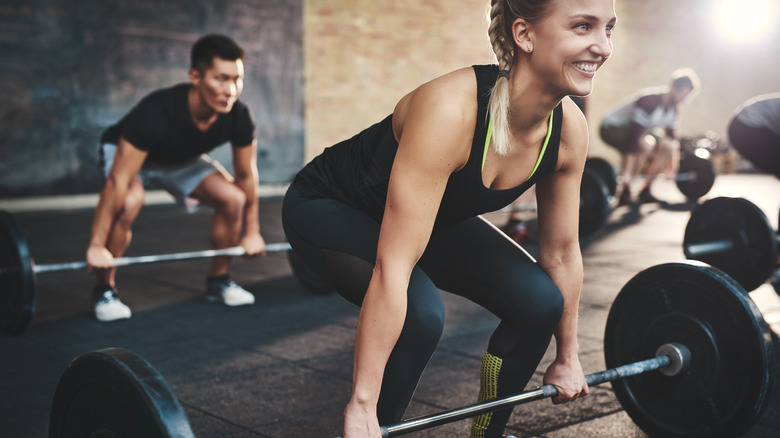 Woman lifting in a class