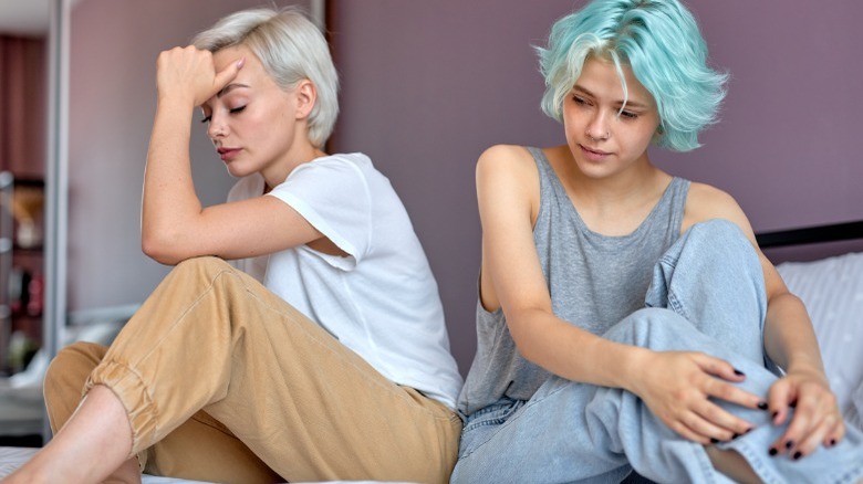 Women sitting on a bed