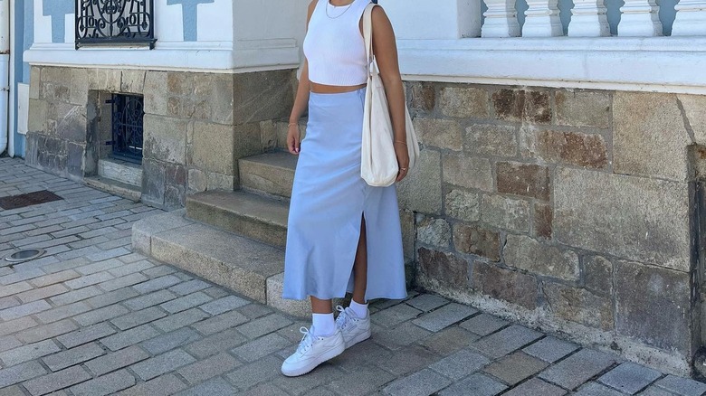 woman wearing a blue midi skirt