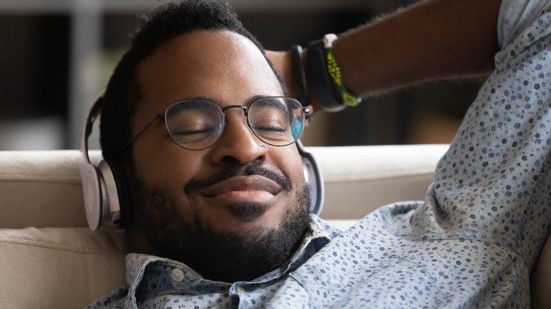 Black man relaxing with headphones