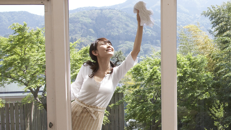 Woman cleaning her windows